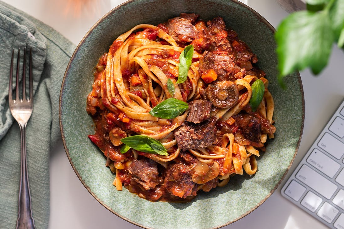 a bowl of spaghetti and meatballs